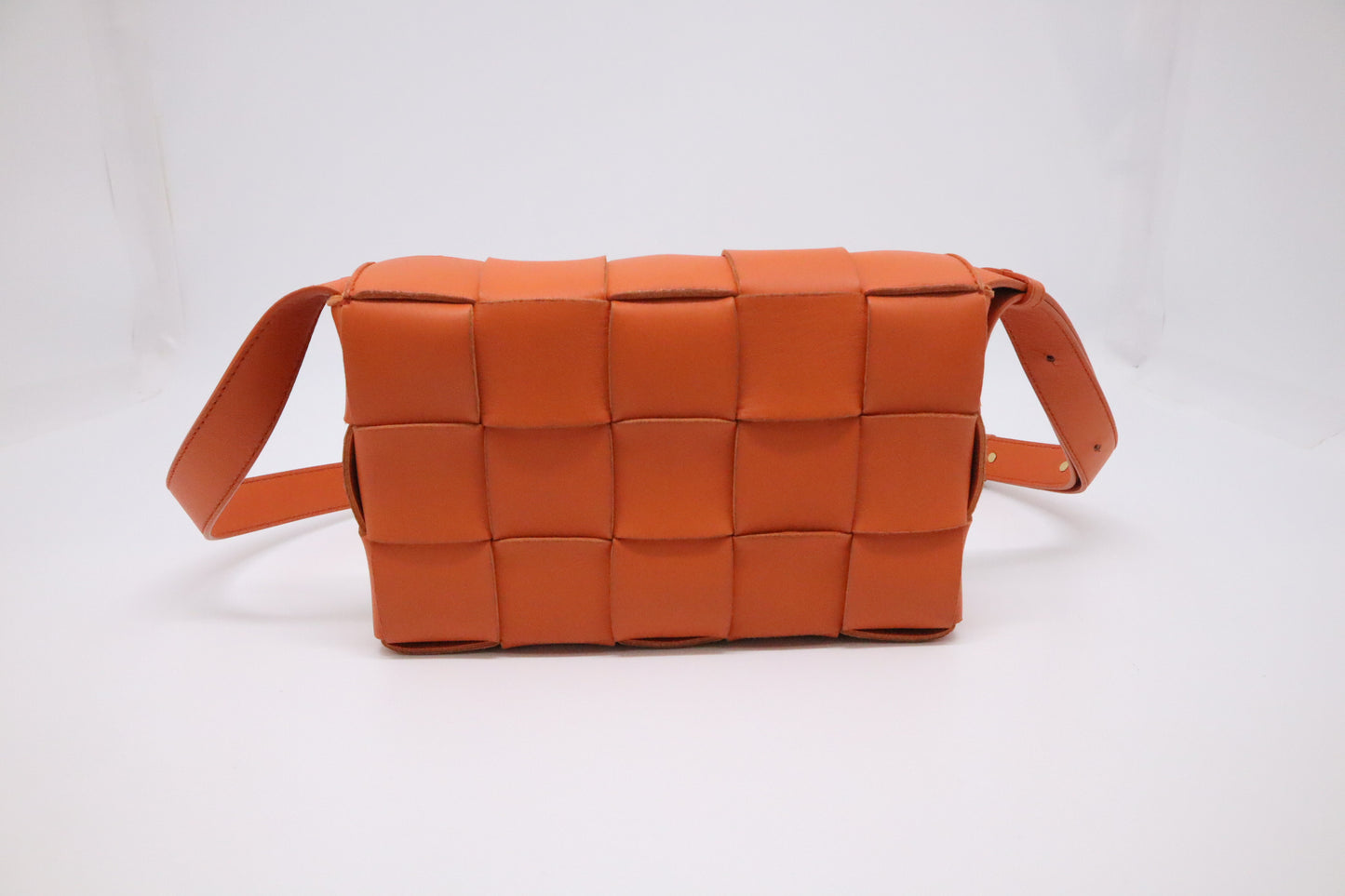 Bottega Veneta Cassette in Orange Intrecciato Leather