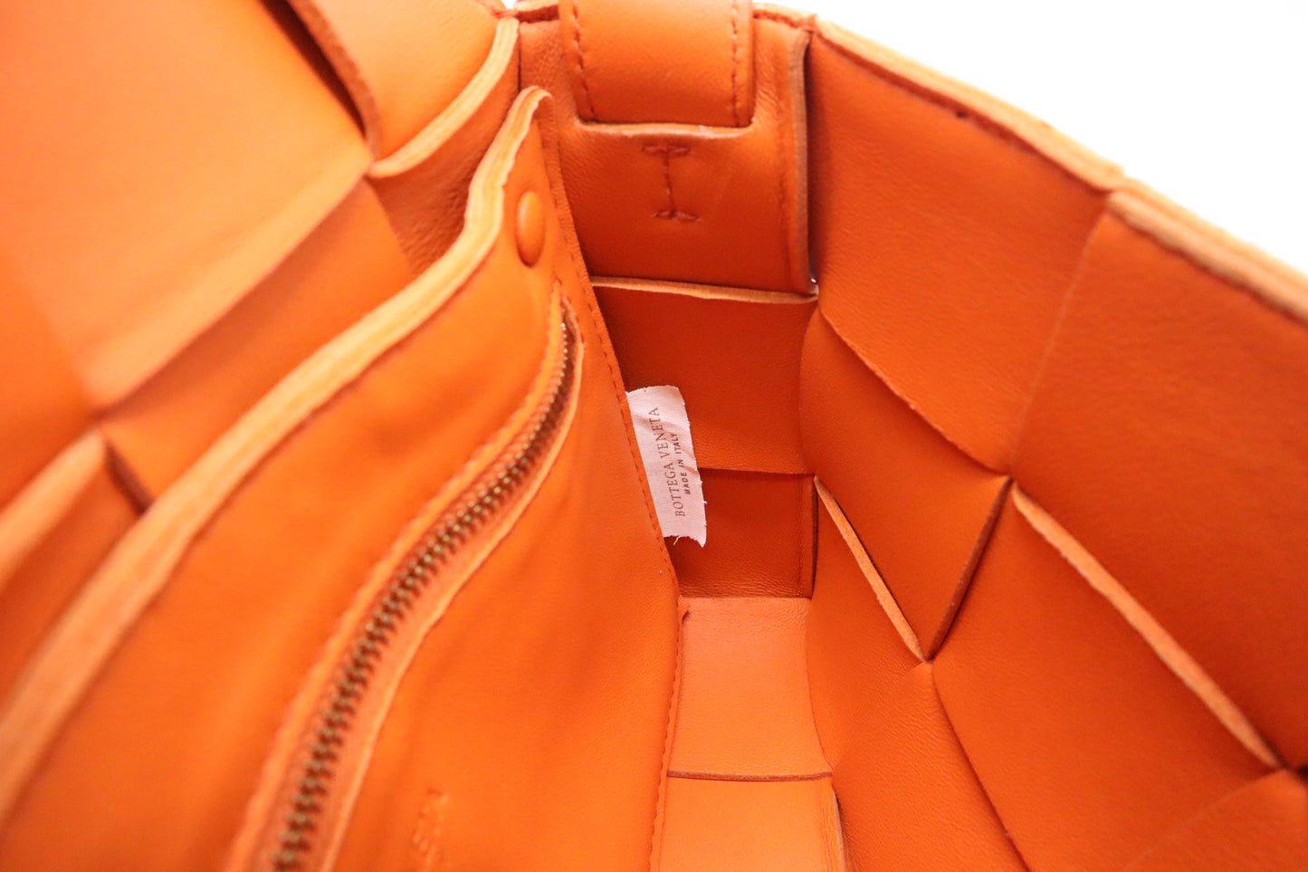 Bottega Veneta Cassette in Orange Intrecciato Leather