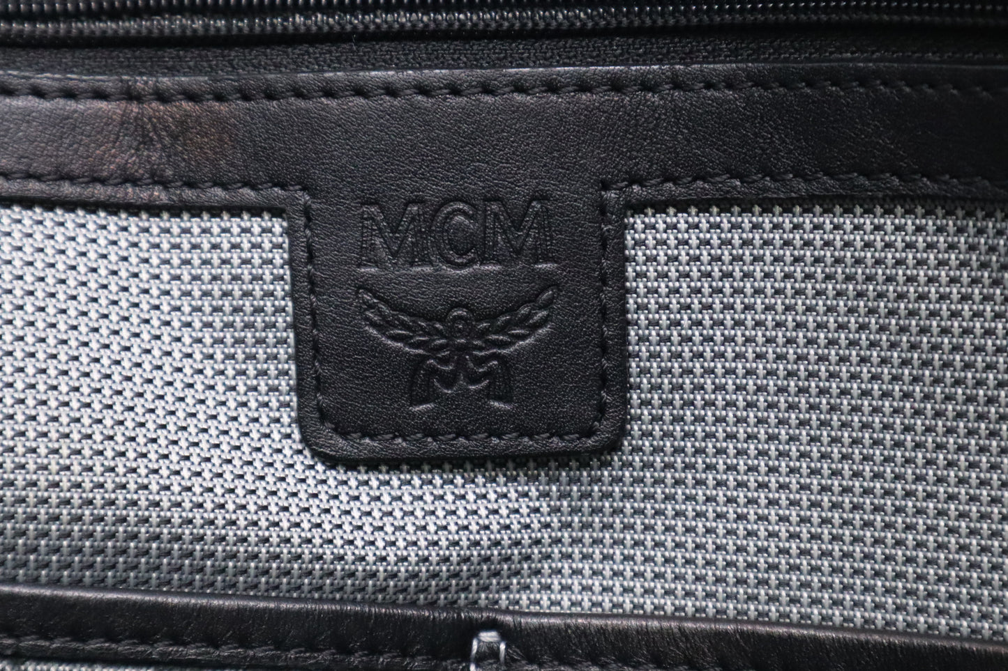 MCM Clutch Bag in Black Visetos Canvas and Leather